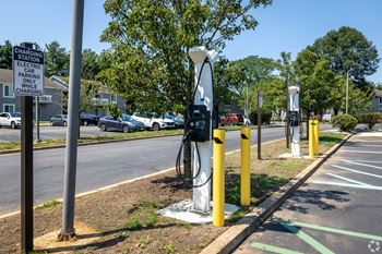 A charging station for electric vehicles is located in a parking lot.